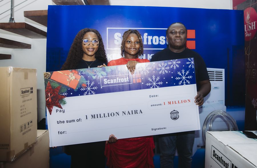 Past Hilda Baci Academy winners holding an oversized ₦1 million cheque alongside Scanfrost appliances